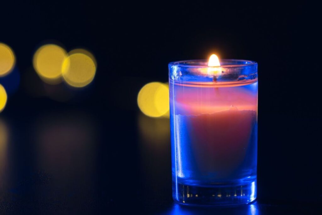 Soft candle flame symbolizing calm awareness and transforming anger into peace.