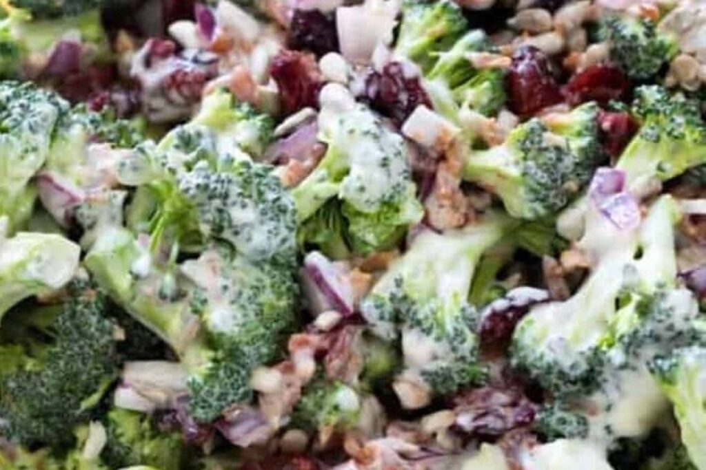 Best broccoli salad with cranberries, pumpkin seeds, and creamy dressing.