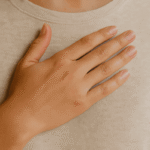 A hand resting gently on the heart, symbolizing self-worth, healing, and inner truth.
